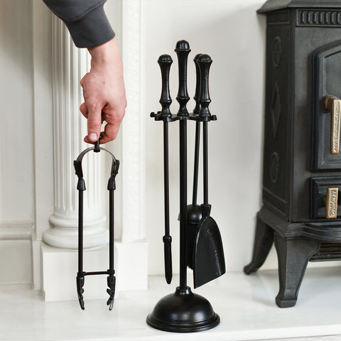 Black Four Piece Fireside Tools Set With Hand For Scale