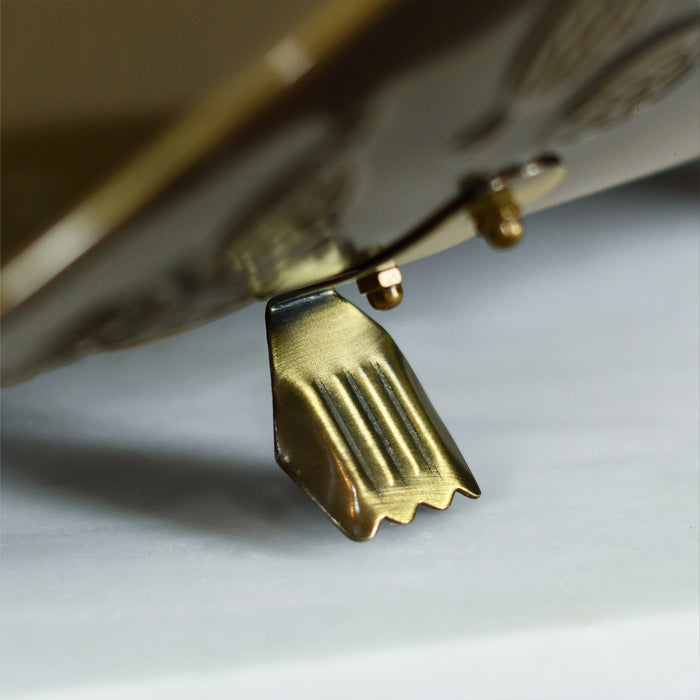 Close Up Of Brass Feet