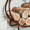    Close Up Of Logs In Copper Frame