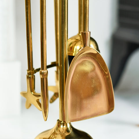    Close Up Of Polished Brass Fireside Tools