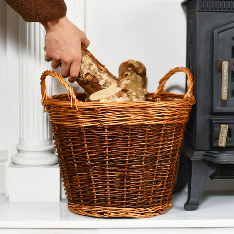 Hand Reaching To Get A Log From Basket