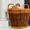 Log Basket With Logs In Against A White Background