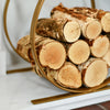 Side View Of Brass Finish Log Rack With Logs In Situ