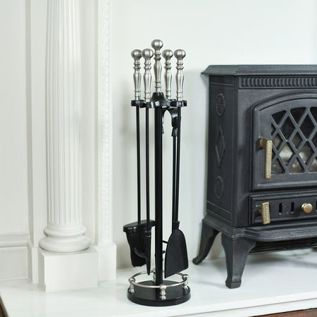 Tall Fireside Set Next To A Stove 