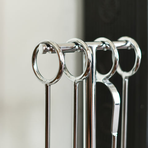 Looped handles on contemporary fireside tools set 